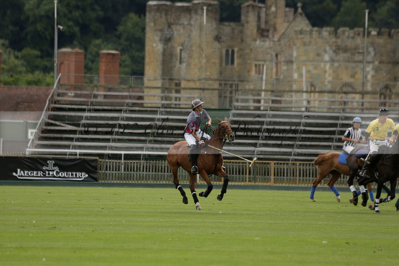 La Tremenda (lilac) v Maiz Dulce (yellow) in a Brecknock Cup polo match played on Lawns 1 at the Cowdray Park Polo Club on Tuesday 13 August 2013