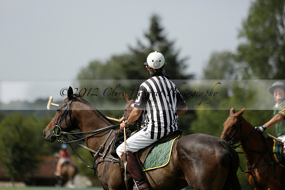 Maiz Dulce (green) v River (blue) in a Uber Polo Midsummer 12 goal polo match on Wednesday 21 August 2013 at Cowdray park Polo Club on Ambersham 2.  www.polopictures.co.uk