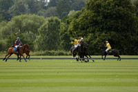 La Tremenda (lilac) v Maiz Dulce (yellow) in a Brecknock Cup polo match played on Lawns 1 at the Cowdray Park Polo Club on Tuesday 13 August 2013