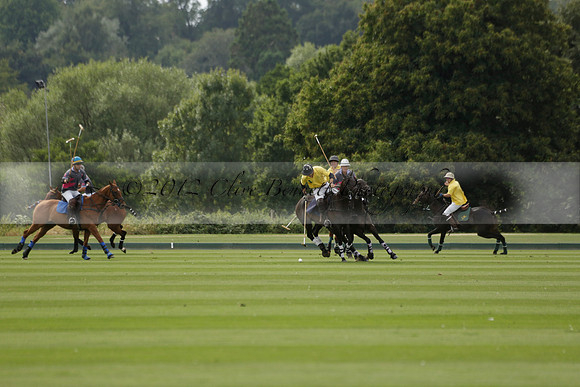 La Tremenda (lilac) v Maiz Dulce (yellow) in a Brecknock Cup polo match played on Lawns 1 at the Cowdray Park Polo Club on Tuesday 13 August 2013