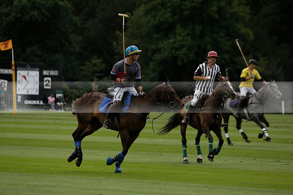 La Tremenda (lilac) v Maiz Dulce (yellow) in a Brecknock Cup polo match played on Lawns 1 at the Cowdray Park Polo Club on Tuesday 13 August 2013