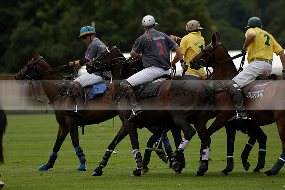La Tremenda (lilac) v Maiz Dulce (yellow) in a Brecknock Cup polo match played on Lawns 1 at the Cowdray Park Polo Club on Tuesday 13 August 2013