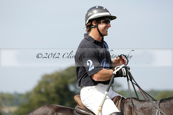 Maiz Dulce (green) v River (blue) in a Uber Polo Midsummer 12 goal polo match on Wednesday 21 August 2013 at Cowdray park Polo Club on Ambersham 2.  www.polopictures.co.uk
