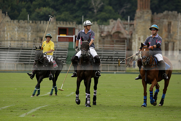 La Tremenda (lilac) v Maiz Dulce (yellow) in a Brecknock Cup polo match played on Lawns 1 at the Cowdray Park Polo Club on Tuesday 13 August 2013