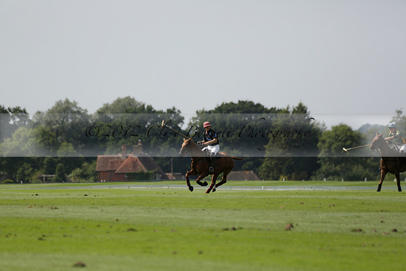 Maiz Dulce (green) v River (blue) in a Uber Polo Midsummer 12 goal polo match on Wednesday 21 August 2013 at Cowdray park Polo Club on Ambersham 2.  www.polopictures.co.uk
