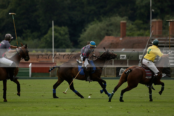 La Tremenda (lilac) v Maiz Dulce (yellow) in a Brecknock Cup polo match played on Lawns 1 at the Cowdray Park Polo Club on Tuesday 13 August 2013