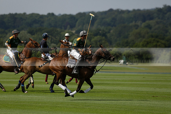 Maiz Dulce (green) v River (blue) in a Uber Polo Midsummer 12 goal polo match on Wednesday 21 August 2013 at Cowdray park Polo Club on Ambersham 2.  www.polopictures.co.uk