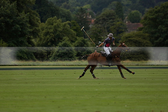 La Tremenda (lilac) v Maiz Dulce (yellow) in a Brecknock Cup polo match played on Lawns 1 at the Cowdray Park Polo Club on Tuesday 13 August 2013