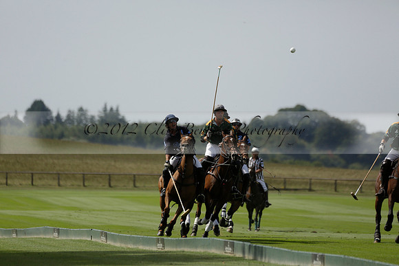 Maiz Dulce (green) v River (blue) in a Uber Polo Midsummer 12 goal polo match on Wednesday 21 August 2013 at Cowdray park Polo Club on Ambersham 2.  www.polopictures.co.uk