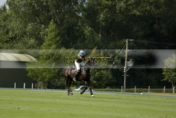 Maiz Dulce (green) v River (blue) in a Uber Polo Midsummer 12 goal polo match on Wednesday 21 August 2013 at Cowdray park Polo Club on Ambersham 2.  www.polopictures.co.uk