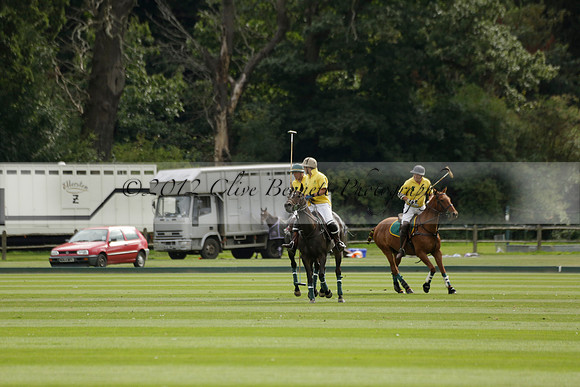 La Tremenda (lilac) v Maiz Dulce (yellow) in a Brecknock Cup polo match played on Lawns 1 at the Cowdray Park Polo Club on Tuesday 13 August 2013