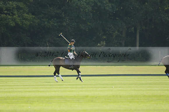 La Tremenda (mauve) v Maiz Dulce (green) in the Brecknock Cup  final polo match. Played at Cowdray Park Polo Club on Sunday 25 August 2013 on Ambersham 1. www.polopictures.co.uk