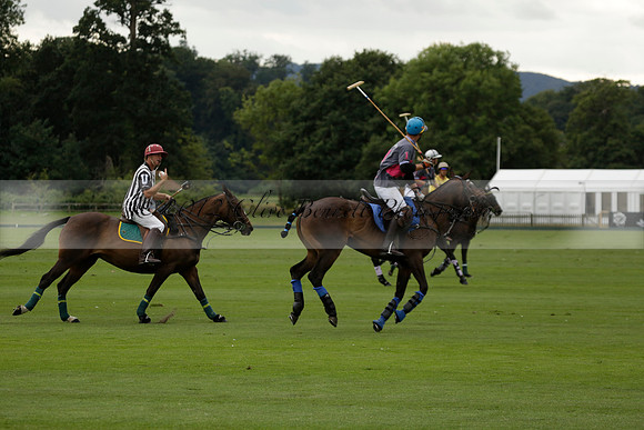 La Tremenda (lilac) v Maiz Dulce (yellow) in a Brecknock Cup polo match played on Lawns 1 at the Cowdray Park Polo Club on Tuesday 13 August 2013