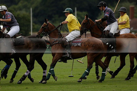La Tremenda (lilac) v Maiz Dulce (yellow) in a Brecknock Cup polo match played on Lawns 1 at the Cowdray Park Polo Club on Tuesday 13 August 2013