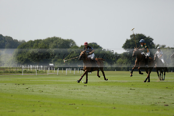 Maiz Dulce (green) v River (blue) in a Uber Polo Midsummer 12 goal polo match on Wednesday 21 August 2013 at Cowdray park Polo Club on Ambersham 2.  www.polopictures.co.uk