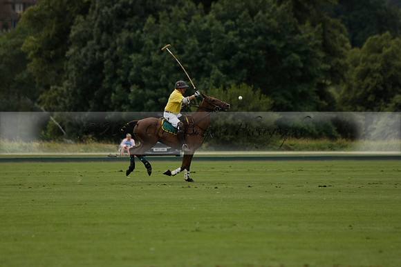 La Tremenda (lilac) v Maiz Dulce (yellow) in a Brecknock Cup polo match played on Lawns 1 at the Cowdray Park Polo Club on Tuesday 13 August 2013