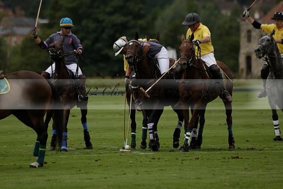 La Tremenda (lilac) v Maiz Dulce (yellow) in a Brecknock Cup polo match played on Lawns 1 at the Cowdray Park Polo Club on Tuesday 13 August 2013
