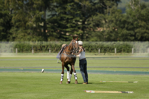 Maiz Dulce (green) v River (blue) in a Uber Polo Midsummer 12 goal polo match on Wednesday 21 August 2013 at Cowdray park Polo Club on Ambersham 2.  www.polopictures.co.uk