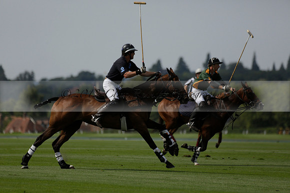Maiz Dulce (green) v River (blue) in a Uber Polo Midsummer 12 goal polo match on Wednesday 21 August 2013 at Cowdray park Polo Club on Ambersham 2.  www.polopictures.co.uk