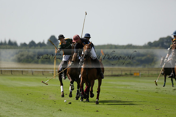 Maiz Dulce (green) v River (blue) in a Uber Polo Midsummer 12 goal polo match on Wednesday 21 August 2013 at Cowdray park Polo Club on Ambersham 2.  www.polopictures.co.uk