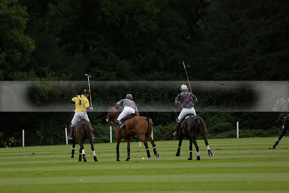La Tremenda (lilac) v Maiz Dulce (yellow) in a Brecknock Cup polo match played on Lawns 1 at the Cowdray Park Polo Club on Tuesday 13 August 2013