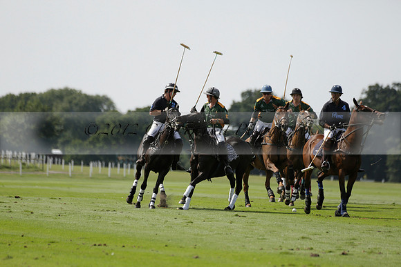 Maiz Dulce (green) v River (blue) in a Uber Polo Midsummer 12 goal polo match on Wednesday 21 August 2013 at Cowdray park Polo Club on Ambersham 2.  www.polopictures.co.uk