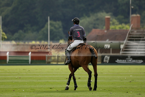 La Tremenda (lilac) v Maiz Dulce (yellow) in a Brecknock Cup polo match played on Lawns 1 at the Cowdray Park Polo Club on Tuesday 13 August 2013