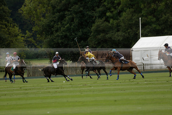 La Tremenda (lilac) v Maiz Dulce (yellow) in a Brecknock Cup polo match played on Lawns 1 at the Cowdray Park Polo Club on Tuesday 13 August 2013