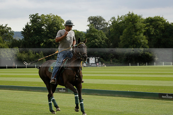 La Tremenda (lilac) v Maiz Dulce (yellow) in a Brecknock Cup polo match played on Lawns 1 at the Cowdray Park Polo Club on Tuesday 13 August 2013