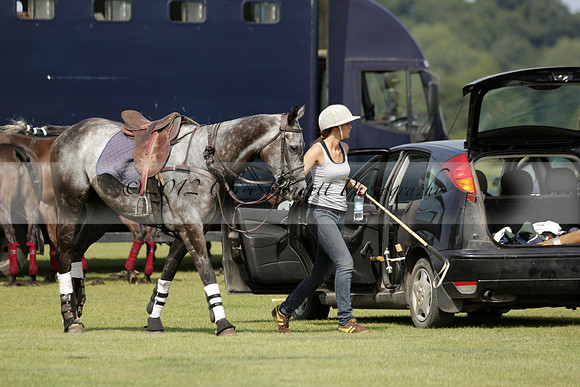 Maiz Dulce (green) v River (blue) in a Uber Polo Midsummer 12 goal polo match on Wednesday 21 August 2013 at Cowdray park Polo Club on Ambersham 2.  www.polopictures.co.uk