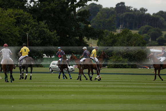 La Tremenda (lilac) v Maiz Dulce (yellow) in a Brecknock Cup polo match played on Lawns 1 at the Cowdray Park Polo Club on Tuesday 13 August 2013