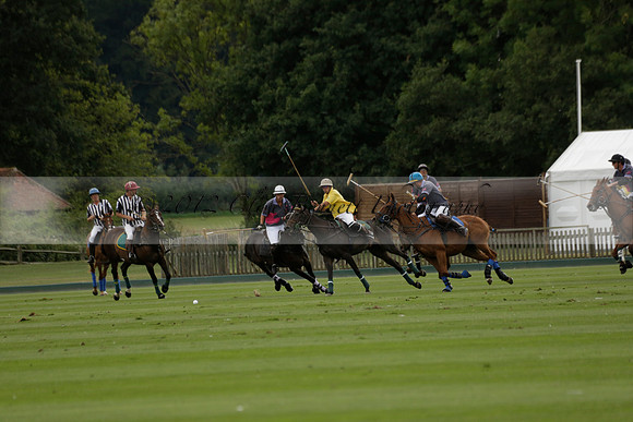 La Tremenda (lilac) v Maiz Dulce (yellow) in a Brecknock Cup polo match played on Lawns 1 at the Cowdray Park Polo Club on Tuesday 13 August 2013