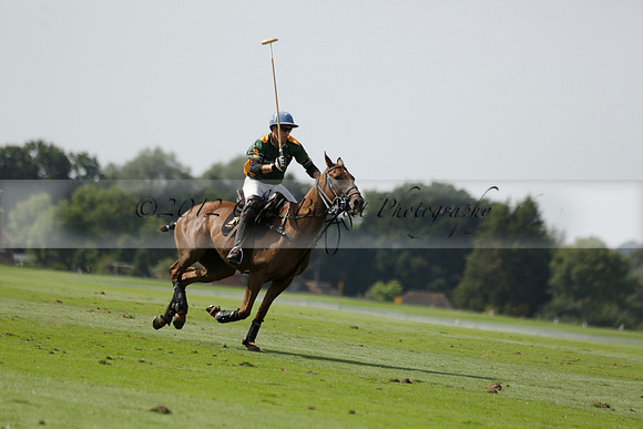 Maiz Dulce (green) v River (blue) in a Uber Polo Midsummer 12 goal polo match on Wednesday 21 August 2013 at Cowdray park Polo Club on Ambersham 2.  www.polopictures.co.uk