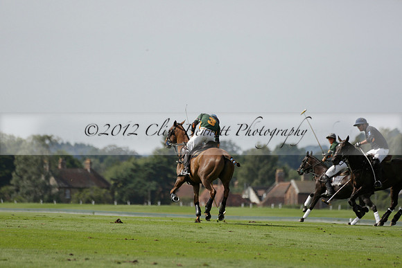 Maiz Dulce (green) v River (blue) in a Uber Polo Midsummer 12 goal polo match on Wednesday 21 August 2013 at Cowdray park Polo Club on Ambersham 2.  www.polopictures.co.uk