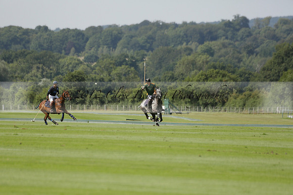 Maiz Dulce (green) v River (blue) in a Uber Polo Midsummer 12 goal polo match on Wednesday 21 August 2013 at Cowdray park Polo Club on Ambersham 2.  www.polopictures.co.uk
