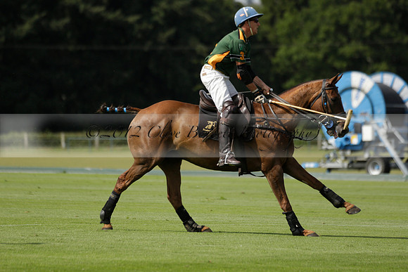 Maiz Dulce (green) v River (blue) in a Uber Polo Midsummer 12 goal polo match on Wednesday 21 August 2013 at Cowdray park Polo Club on Ambersham 2.  www.polopictures.co.uk