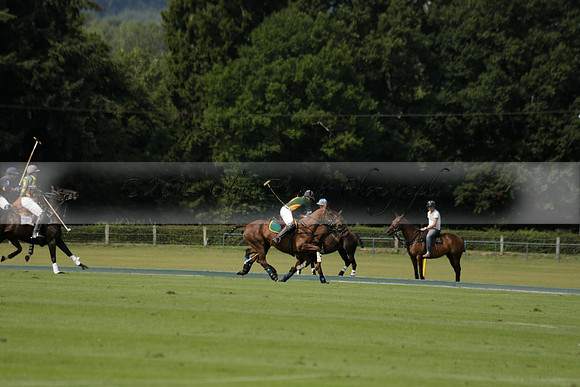 Maiz Dulce (green) v River (blue) in a Uber Polo Midsummer 12 goal polo match on Wednesday 21 August 2013 at Cowdray park Polo Club on Ambersham 2.  www.polopictures.co.uk
