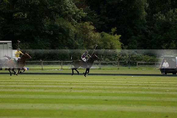 La Tremenda (lilac) v Maiz Dulce (yellow) in a Brecknock Cup polo match played on Lawns 1 at the Cowdray Park Polo Club on Tuesday 13 August 2013