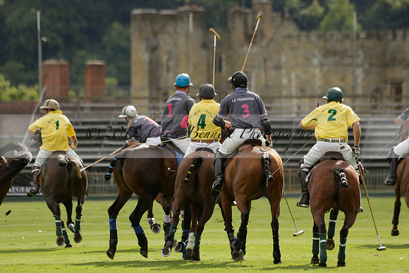 La Tremenda (lilac) v Maiz Dulce (yellow) in a Brecknock Cup polo match played on Lawns 1 at the Cowdray Park Polo Club on Tuesday 13 August 2013