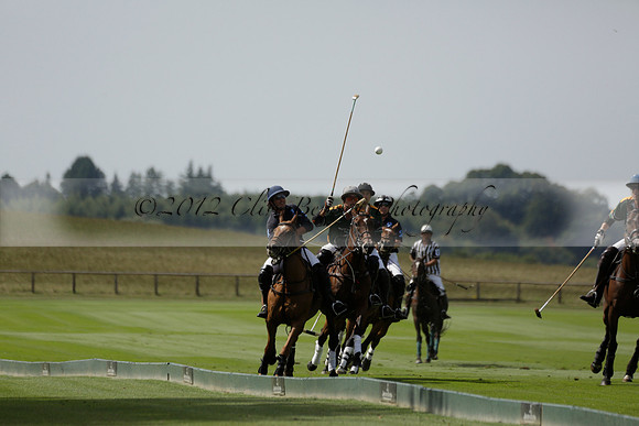 Maiz Dulce (green) v River (blue) in a Uber Polo Midsummer 12 goal polo match on Wednesday 21 August 2013 at Cowdray park Polo Club on Ambersham 2.  www.polopictures.co.uk