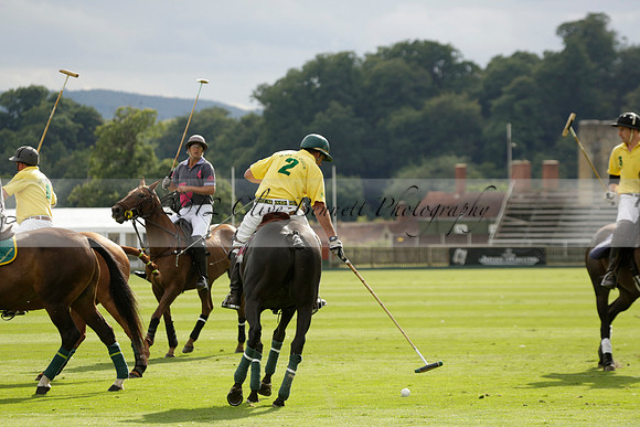 La Tremenda (lilac) v Maiz Dulce (yellow) in a Brecknock Cup polo match played on Lawns 1 at the Cowdray Park Polo Club on Tuesday 13 August 2013