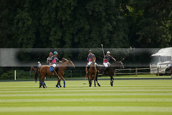 La Tremenda (lilac) v Maiz Dulce (yellow) in a Brecknock Cup polo match played on Lawns 1 at the Cowdray Park Polo Club on Tuesday 13 August 2013