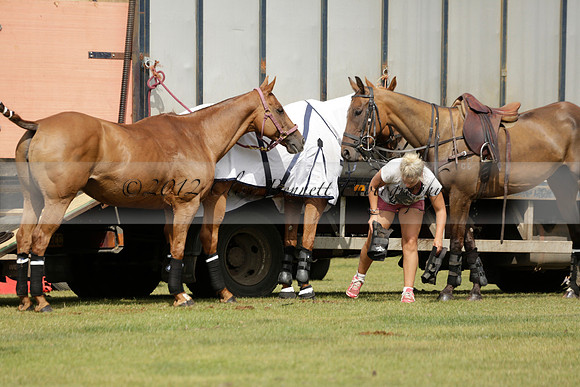 Maiz Dulce (green) v River (blue) in a Uber Polo Midsummer 12 goal polo match on Wednesday 21 August 2013 at Cowdray park Polo Club on Ambersham 2.  www.polopictures.co.uk