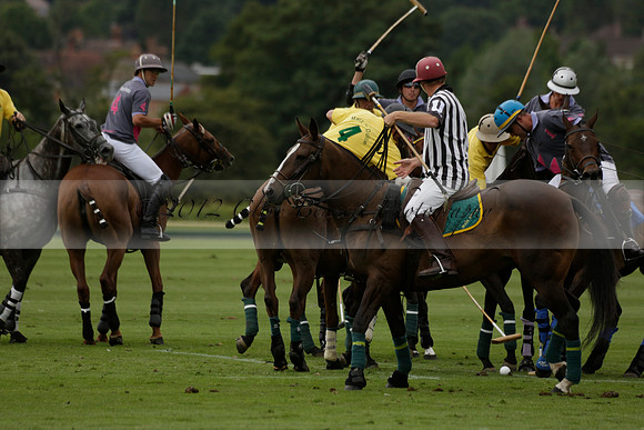 La Tremenda (lilac) v Maiz Dulce (yellow) in a Brecknock Cup polo match played on Lawns 1 at the Cowdray Park Polo Club on Tuesday 13 August 2013