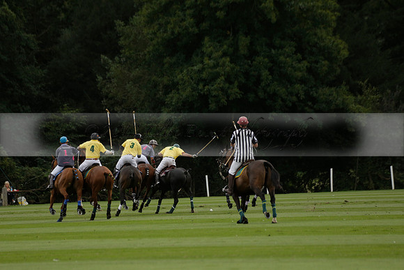 La Tremenda (lilac) v Maiz Dulce (yellow) in a Brecknock Cup polo match played on Lawns 1 at the Cowdray Park Polo Club on Tuesday 13 August 2013