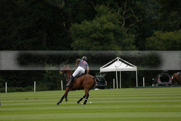 La Tremenda (lilac) v Maiz Dulce (yellow) in a Brecknock Cup polo match played on Lawns 1 at the Cowdray Park Polo Club on Tuesday 13 August 2013