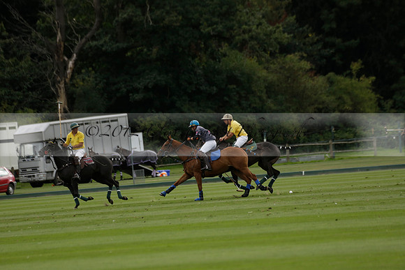 La Tremenda (lilac) v Maiz Dulce (yellow) in a Brecknock Cup polo match played on Lawns 1 at the Cowdray Park Polo Club on Tuesday 13 August 2013