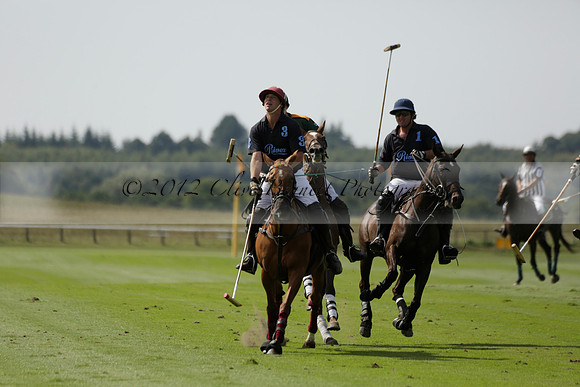 Maiz Dulce (green) v River (blue) in a Uber Polo Midsummer 12 goal polo match on Wednesday 21 August 2013 at Cowdray park Polo Club on Ambersham 2.  www.polopictures.co.uk