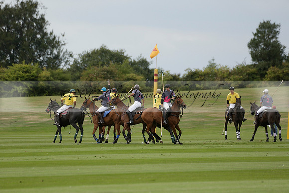La Tremenda (lilac) v Maiz Dulce (yellow) in a Brecknock Cup polo match played on Lawns 1 at the Cowdray Park Polo Club on Tuesday 13 August 2013