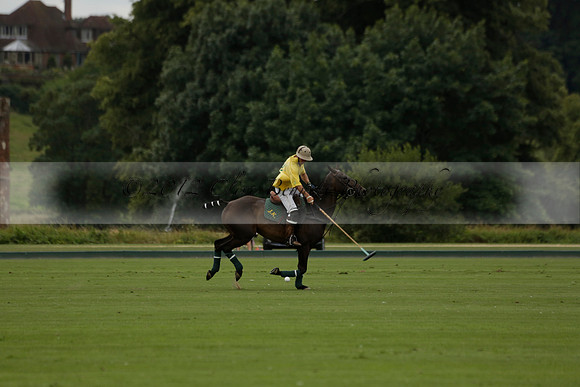 La Tremenda (lilac) v Maiz Dulce (yellow) in a Brecknock Cup polo match played on Lawns 1 at the Cowdray Park Polo Club on Tuesday 13 August 2013